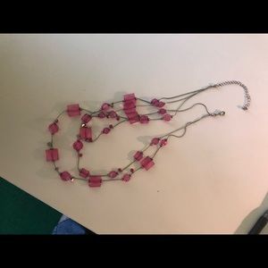 3 Necklaces in various lengths and shades of pink.